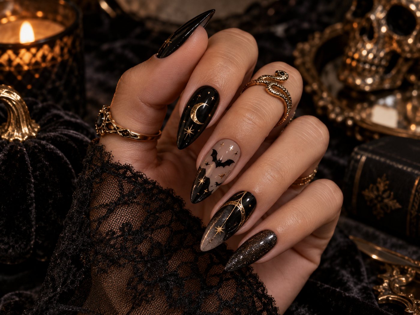 Gothic glam Halloween nails with black and gold details